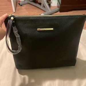 Brand new Steve Madden wrist purse. New without tags, has plastic still on.
